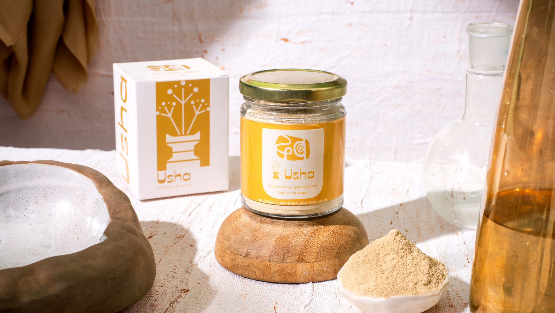 Usha ubtan powder styled with its jar and natural ingredients.